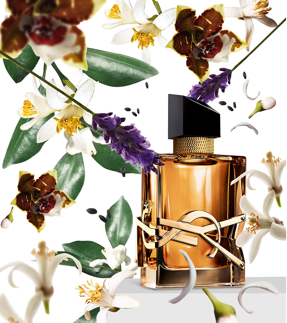 Mock-up of Libre perfume from Yves Saint Laurent under a rain of ingredients, lavender, jasmin, orchid