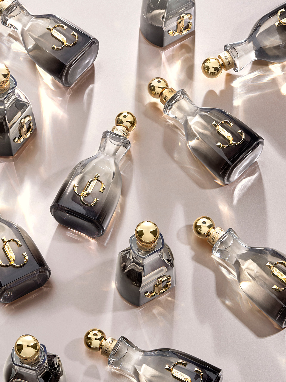jc_md_2 Mock-up of Libre perfume from Yves Saint Laurent under a rain of ingredients, lavender, jasmin, orchid